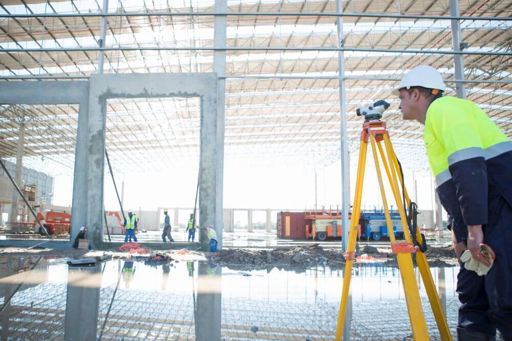 Surveyor Using Tripod And Level On Construction Si 2025 04 04 20 58 19 Utc